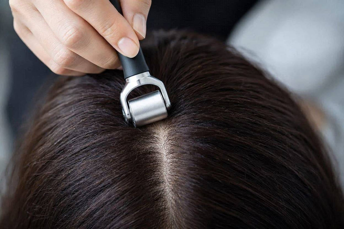 Densara Derma Roller rolled through dark hair at the crown