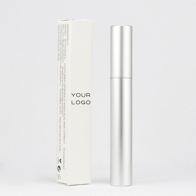 Densara Eyebrow and Lash Fiber Filler silver applicator tube shown with ingredient packaging